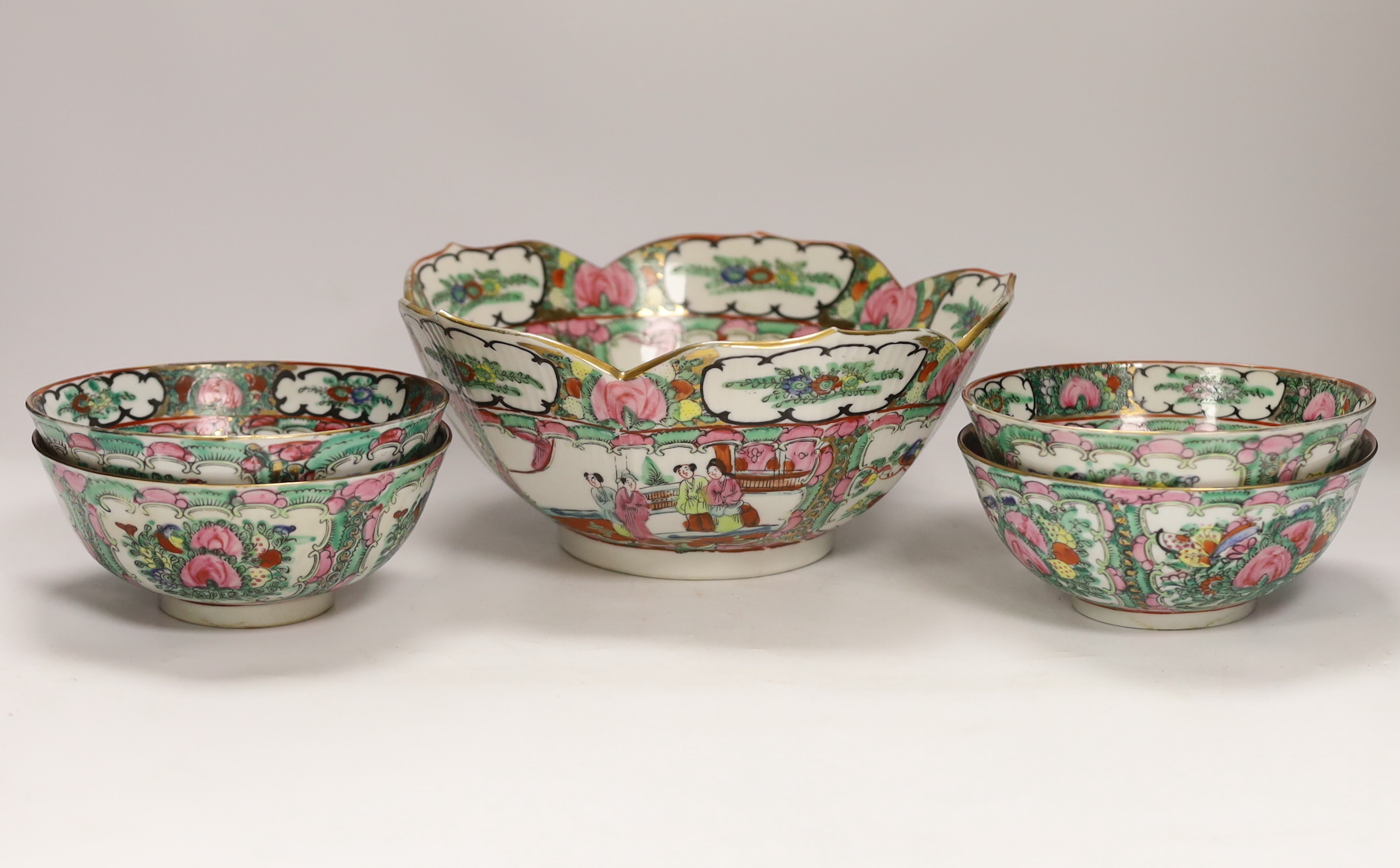 A Chinese famille rose large serving bowl and four smaller bowls, larger bowl 25cm diameter